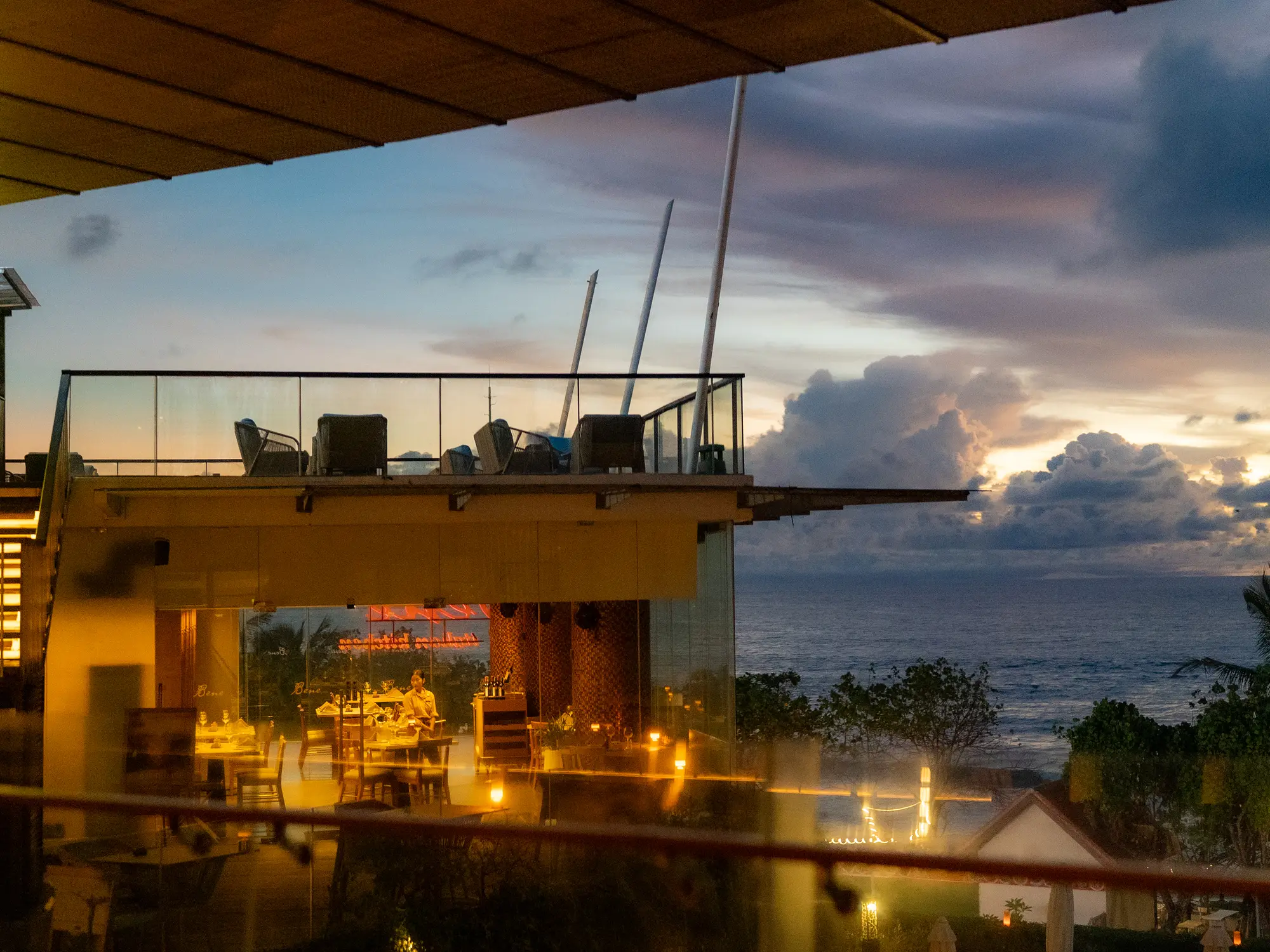 Rooftop terrace at dusk overlooking the coastline